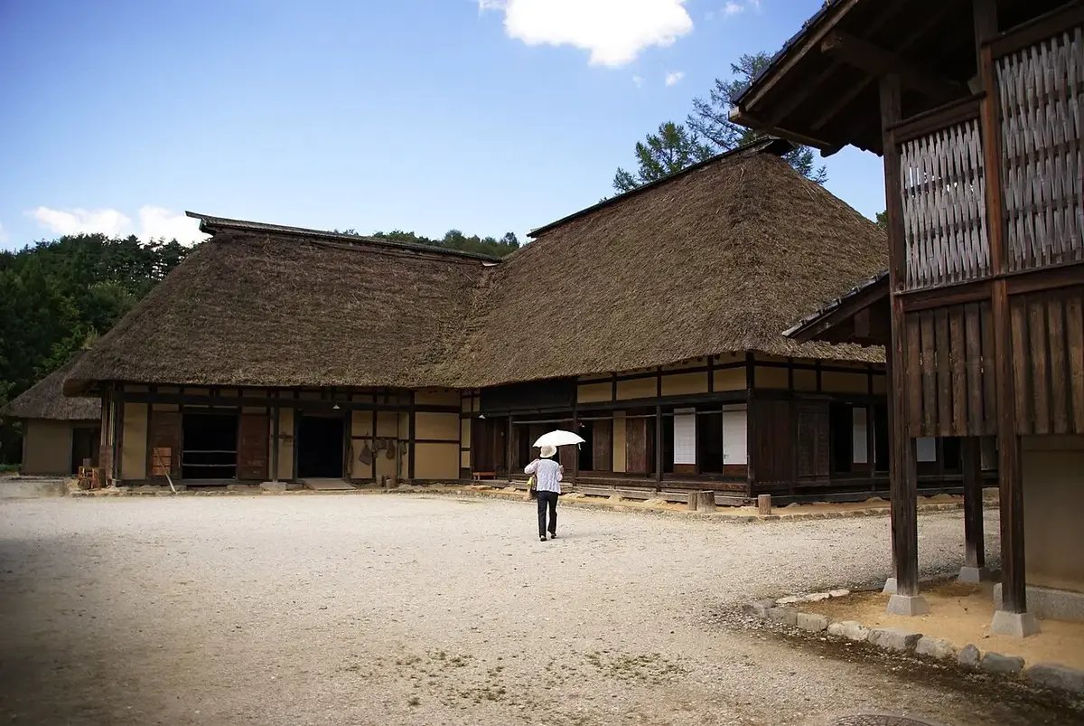 Traditional thatched-roof farmhouses at Tono Furusato Village in Iwate